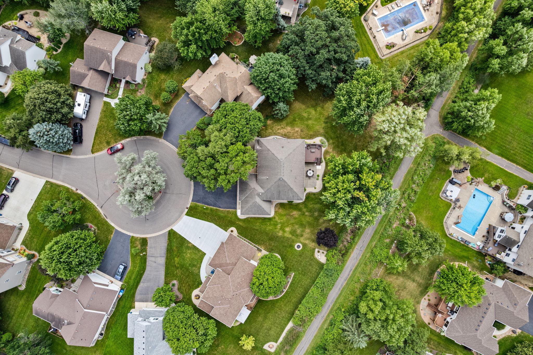 A bird's-eye view highlights the mature trees and exceptional setting.
