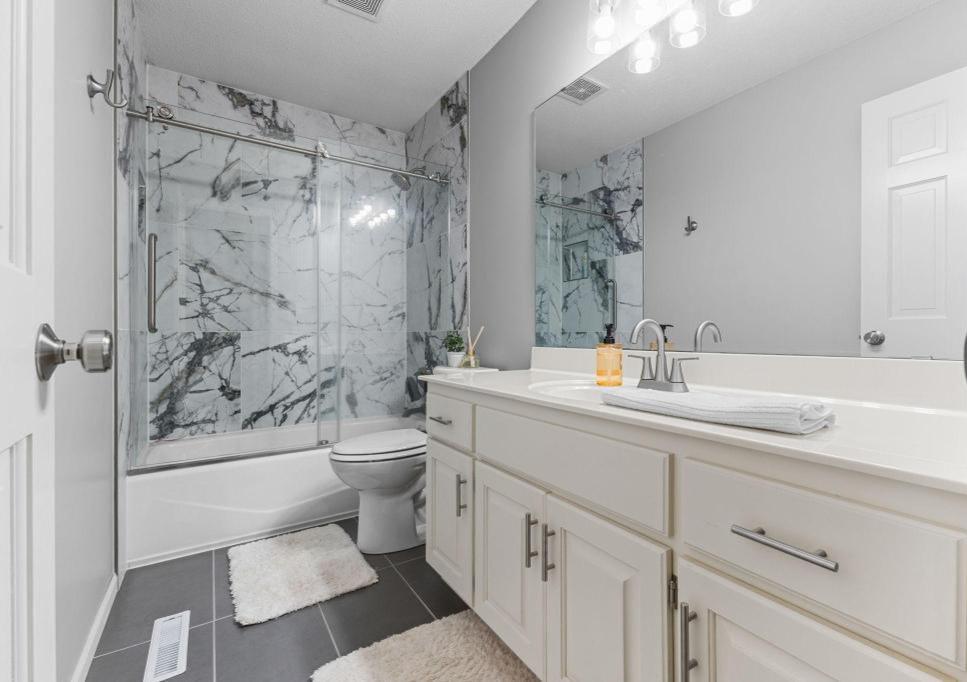 Beautifully updated full bathroom with timeless finishes.
