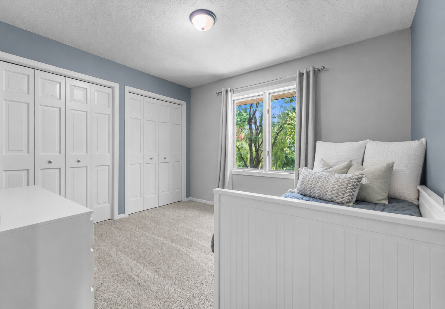 Another spacious bedroom filled with natural light and large closets!