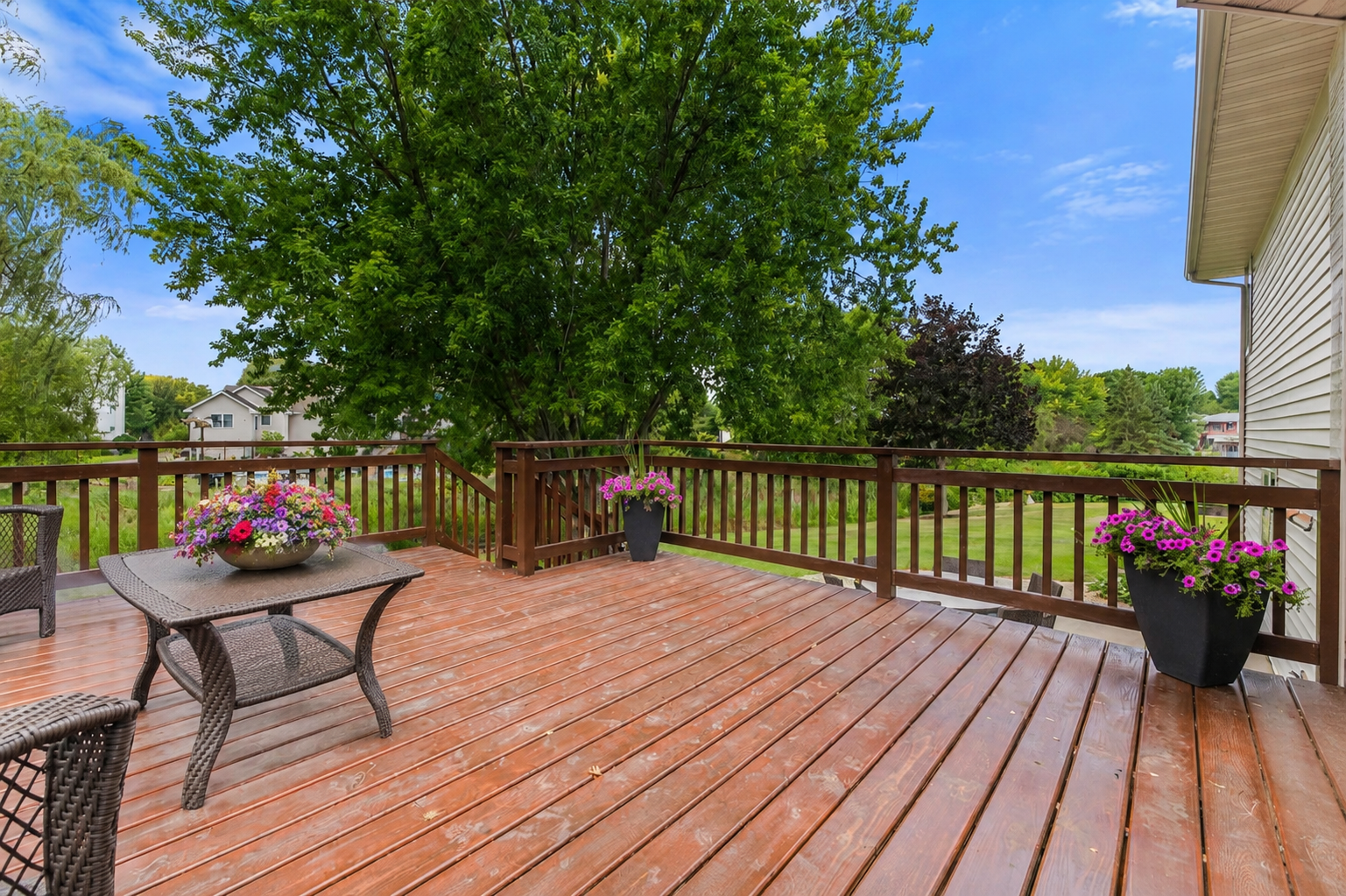 Step onto the spacious deck for an extension of your living space and enjoy an evening cocktail while surrounded by mature trees.