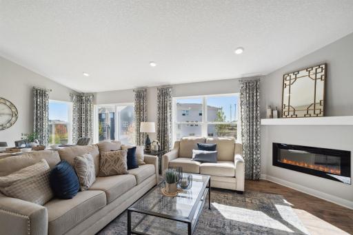 Opposite of the dining area, the home flows right into the main level living room. Photo of model, colors and options will vary.
