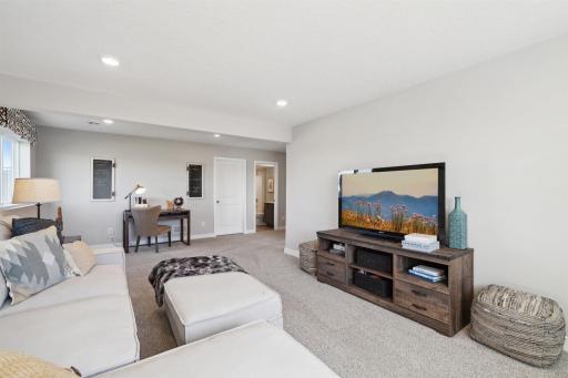All of that living space up - plus this INCLUDED FINISHED lower level which features another full bathroom plus a giant family room! Photo of model, colors and options will vary.