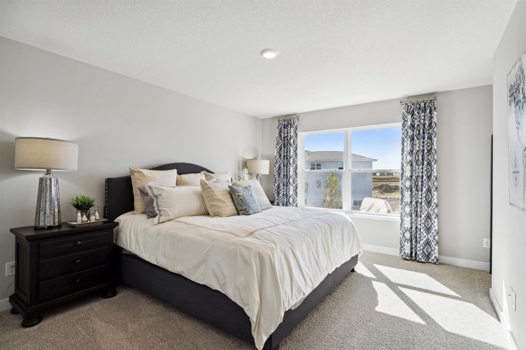Now THAT is a primary bedroom, and the perfect setting to start and finish each day! Photo of model, colors and options will vary.