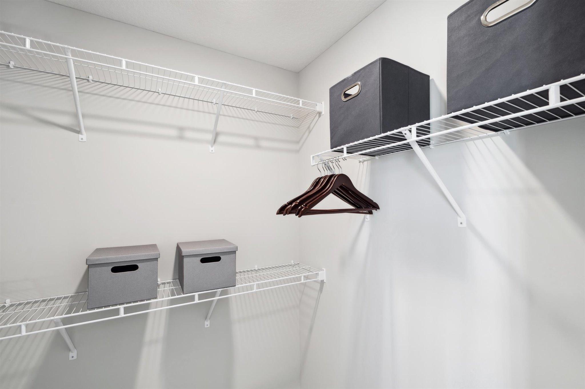 One of TWO walk-in closets in primary. Photo of model, colors and options will vary.