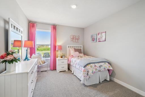 In addition to the primary bedroom, the home's upper level also includes these two additional bedrooms, and another full bathroom just adjacent to each! Photo of model, colors and options will vary.