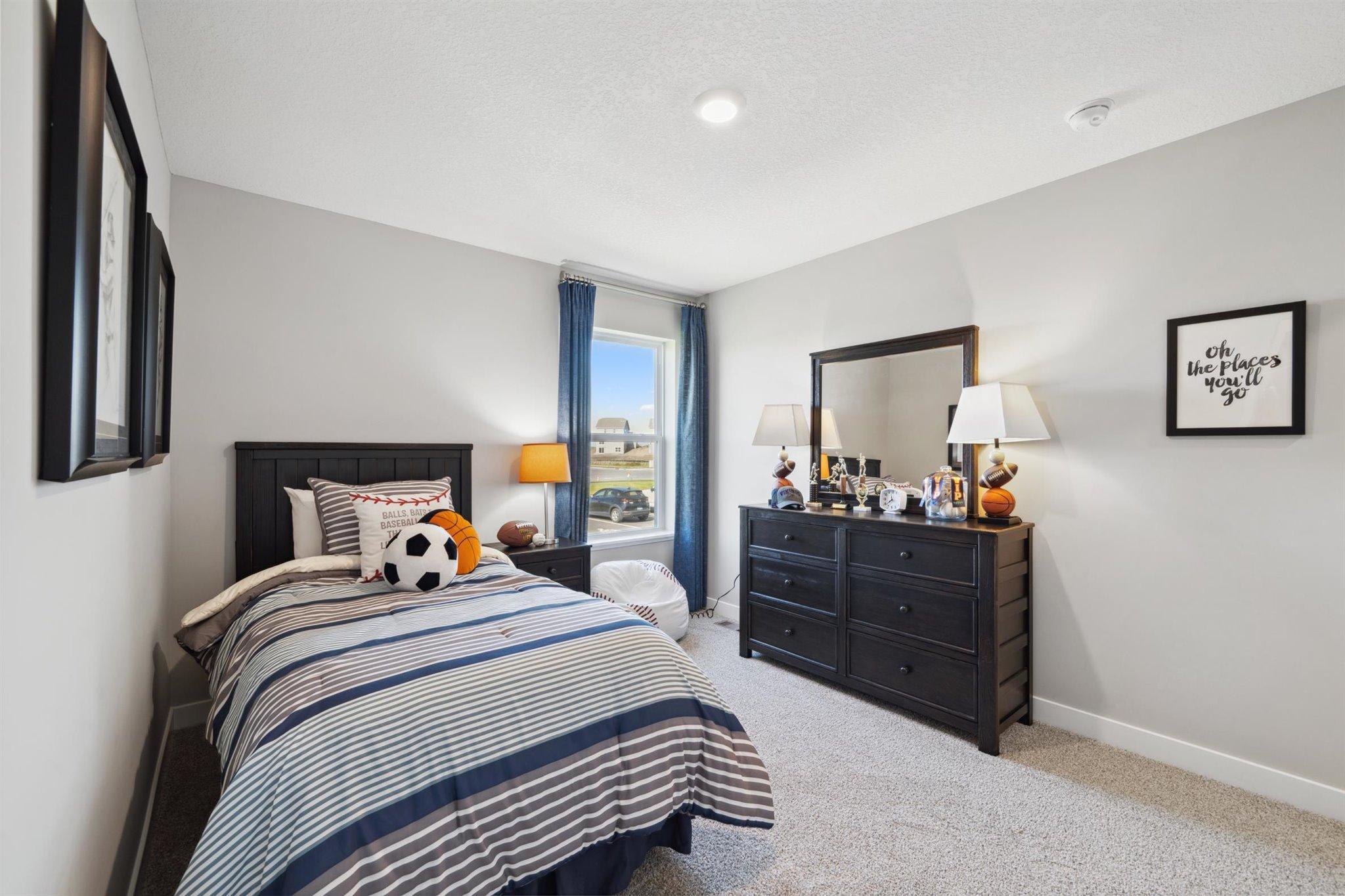 In addition to the primary bedroom, the home's upper level also includes these two additional bedrooms, and another full bathroom just adjacent to each! Photo of model, colors and options will vary.
