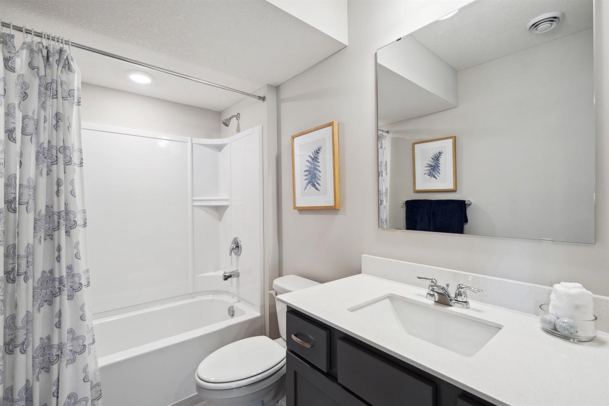 Full bath located on lower-level. Photo of model, colors and options will vary.