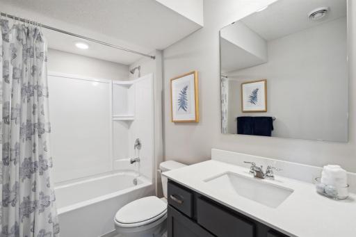Full bath located on lower-level. Photo of model, colors and options will vary.