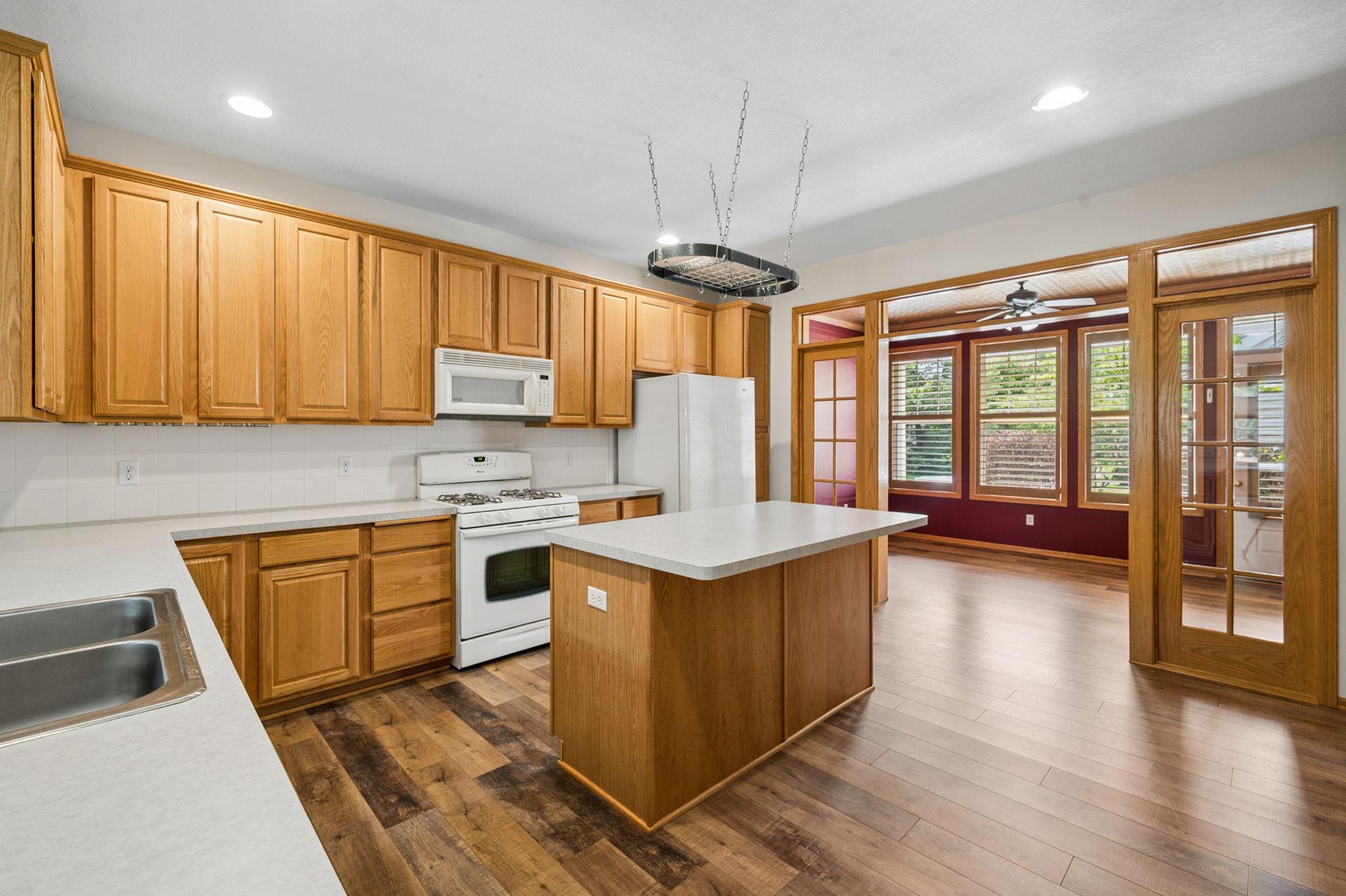 Kitchen has Lots Of Cupboards & A Center Island Breakfast Bar Area