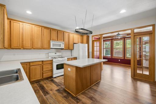 Kitchen has Lots Of Cupboards & A Center Island Breakfast Bar Area