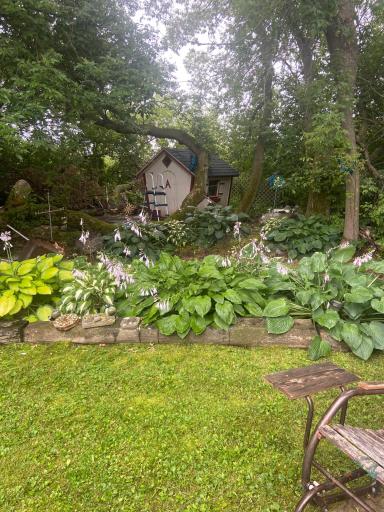 Cute little perennial garden with playhouse