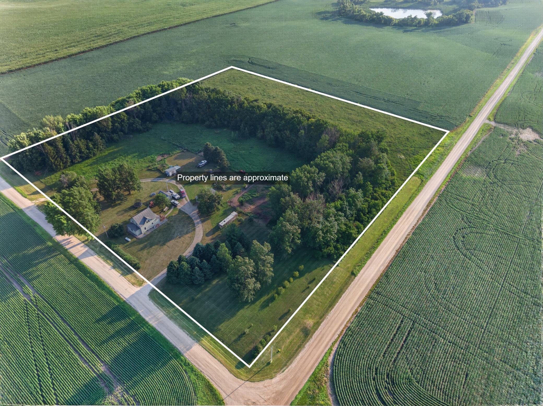 Total of over 11 acres including 2 fenced in pastures (currently set up for horses), tillable, and dense woods