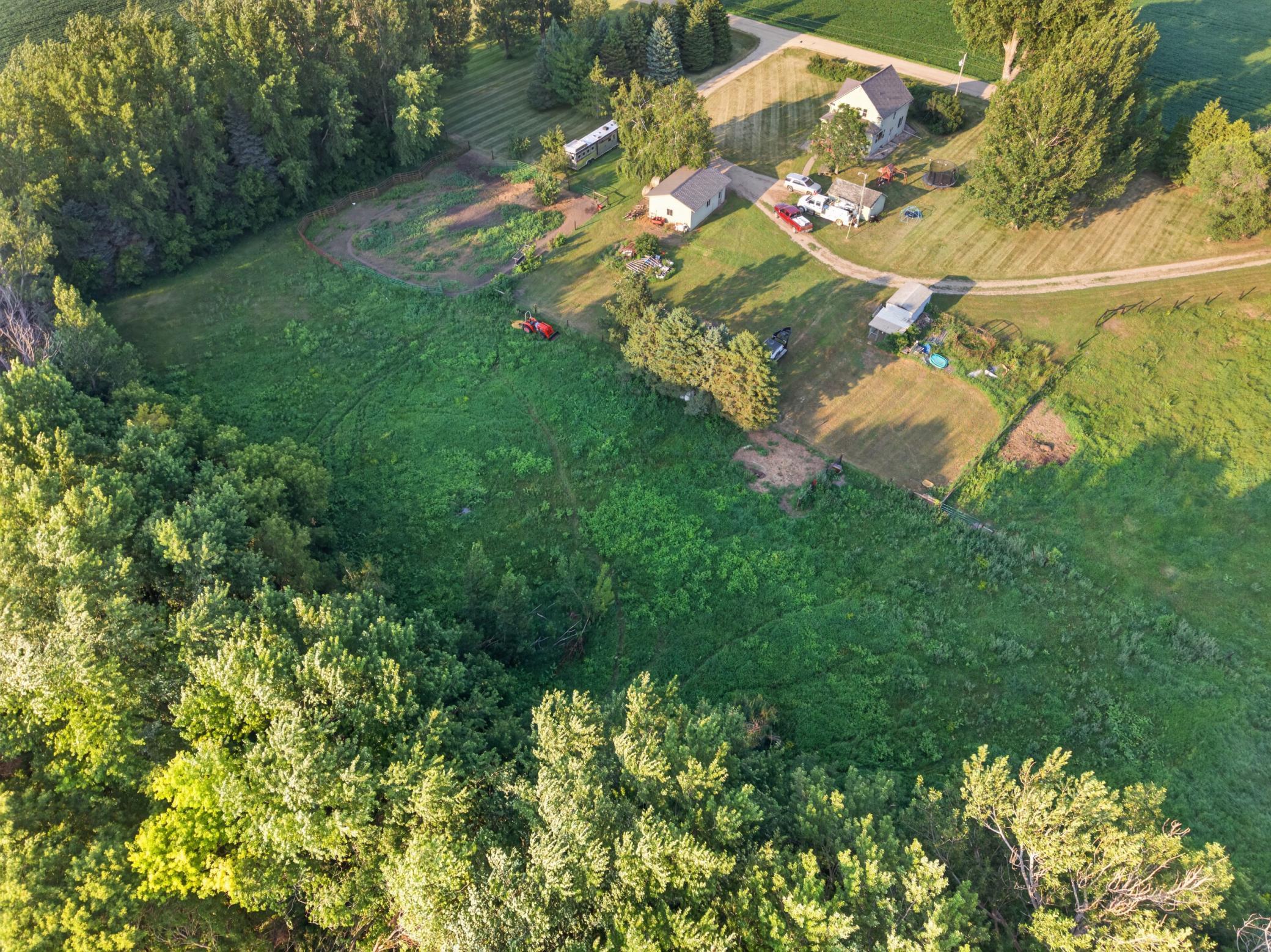 Two fenced in pastures currently set up for horses
