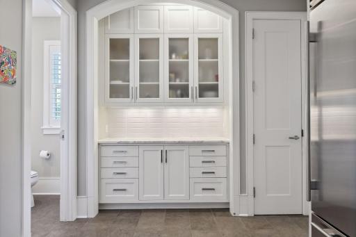 A handy pantry area in the hall connecting the dining room to the kitchen comes in handy when entertaining