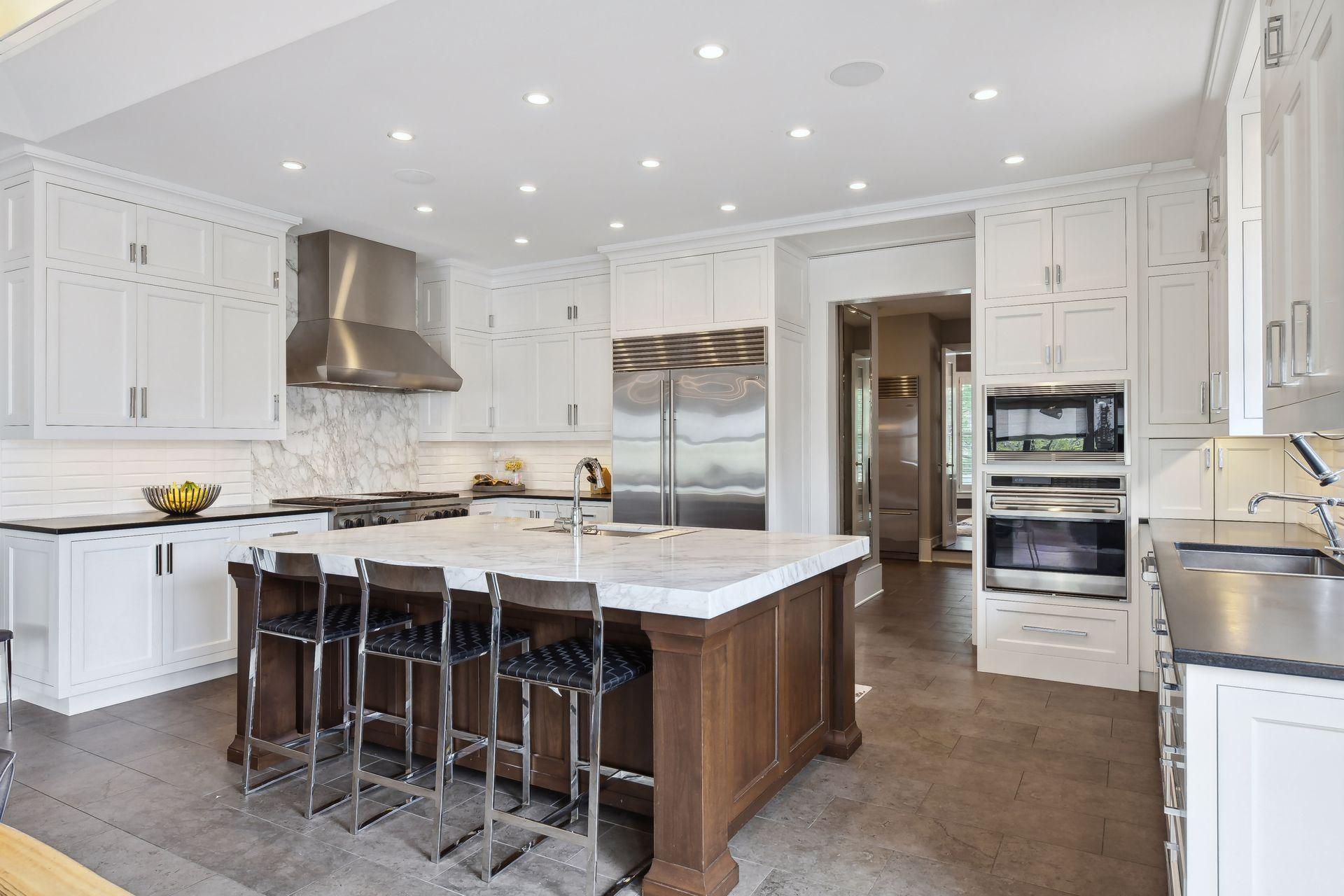 The large center island is ideal for meal prep or grabbing a quick bite to eat
