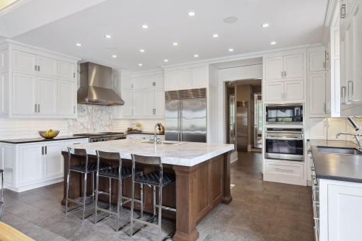 The large center island is ideal for meal prep or grabbing a quick bite to eat