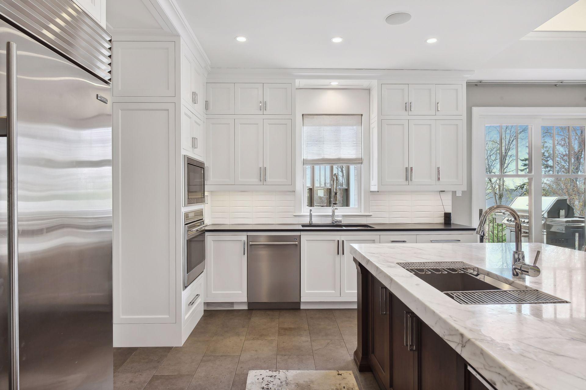 Patio access from the kitchen makes it easy to enjoy using the grill for cooking up a meal