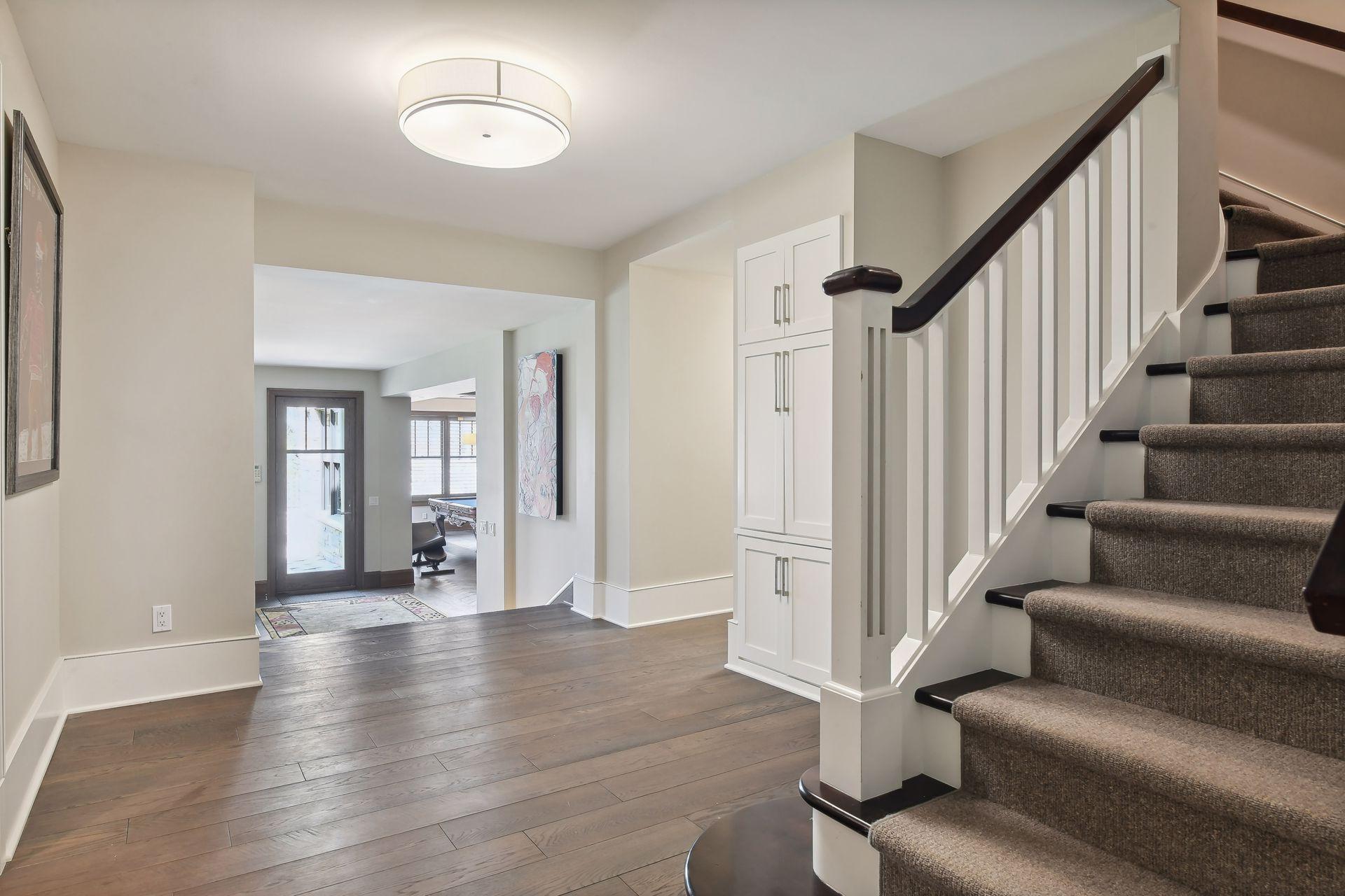 Stairs to the lower level take you to the landing area of this finished space