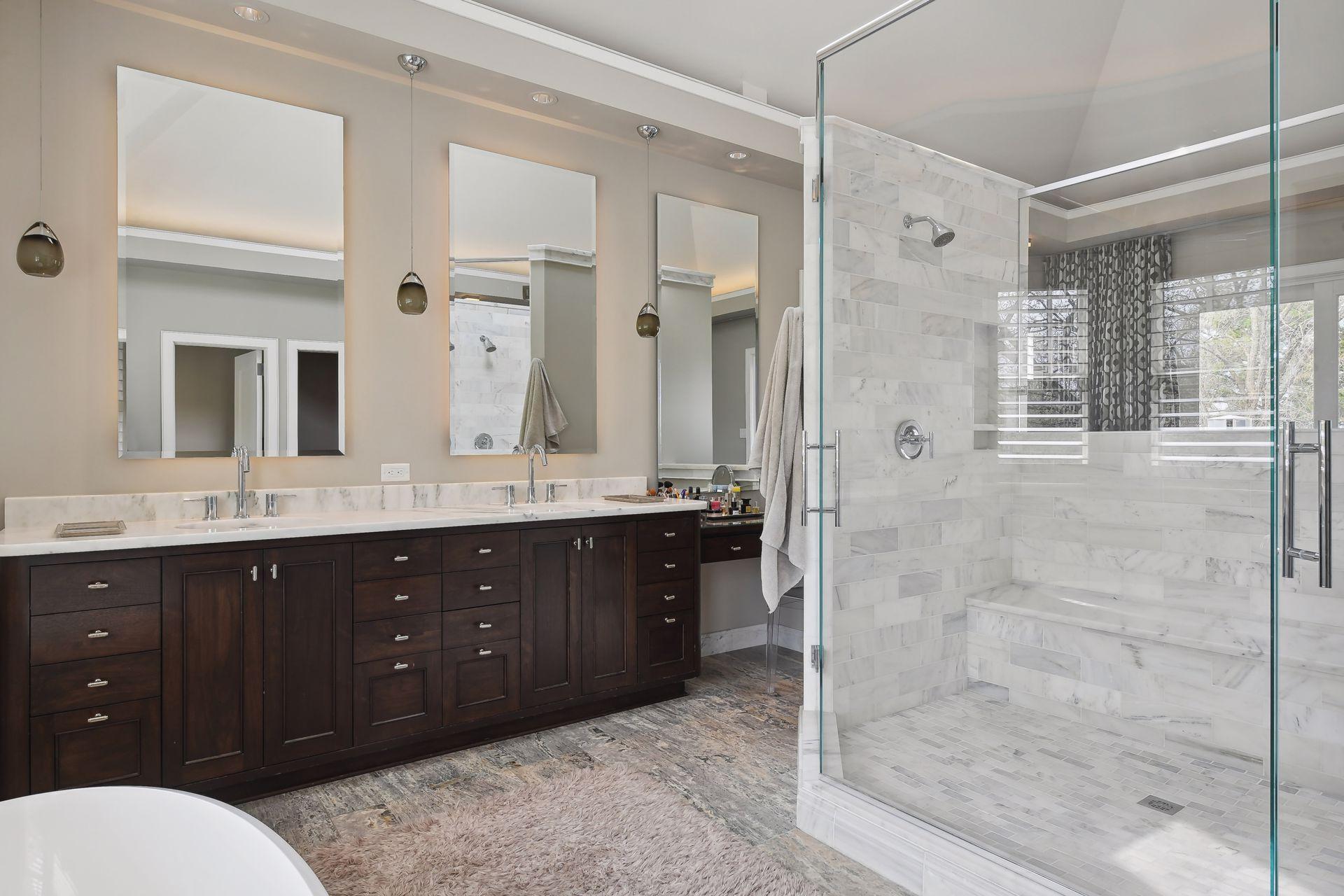 Dual vanity areas, make-up counter, skylight, vaulted ceiling, heated towel racks, soaker tub and separate walk-in shower