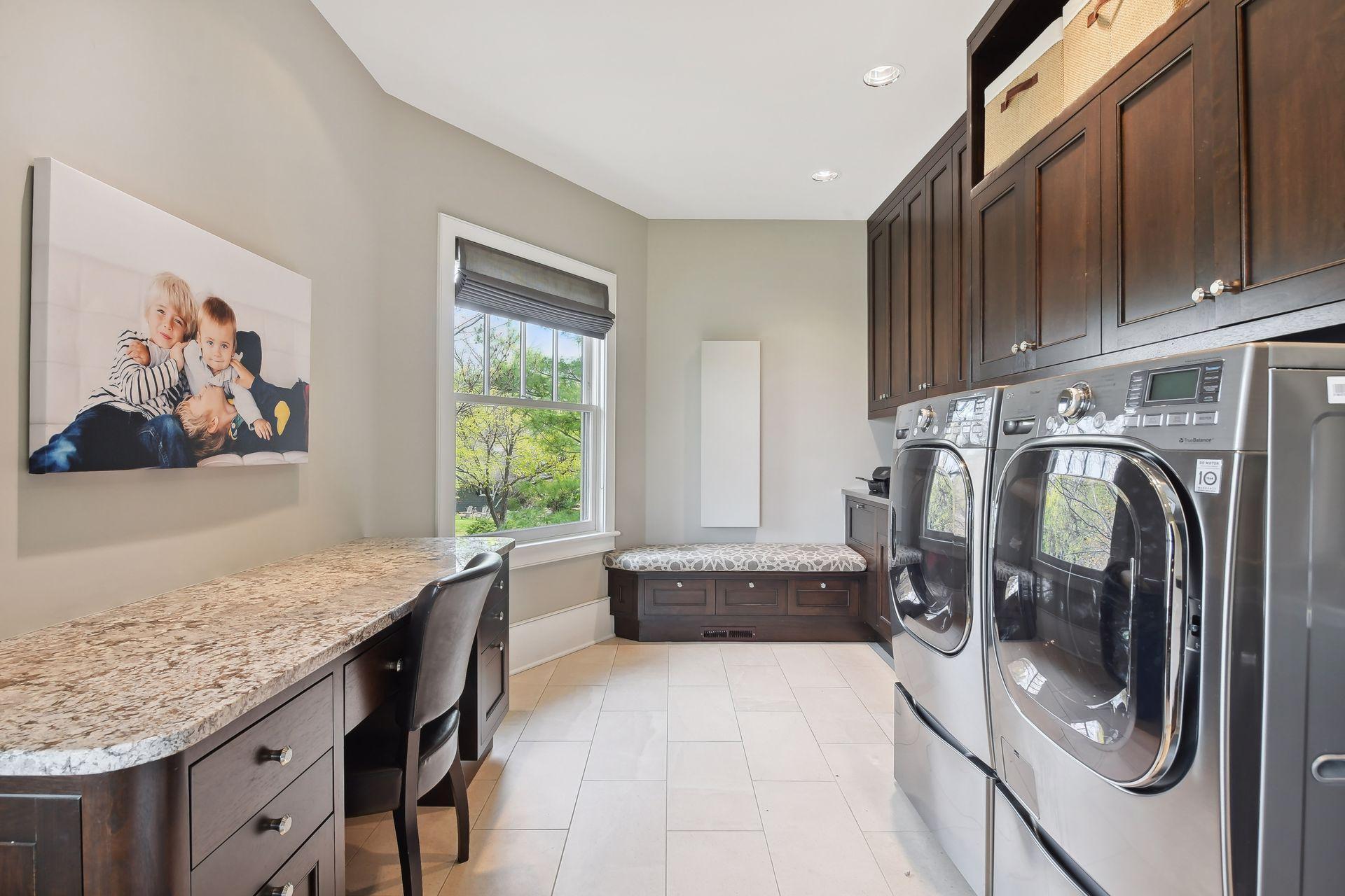 The mundane chore of laundry is enjoyable in this spacious and bright second level laundry room