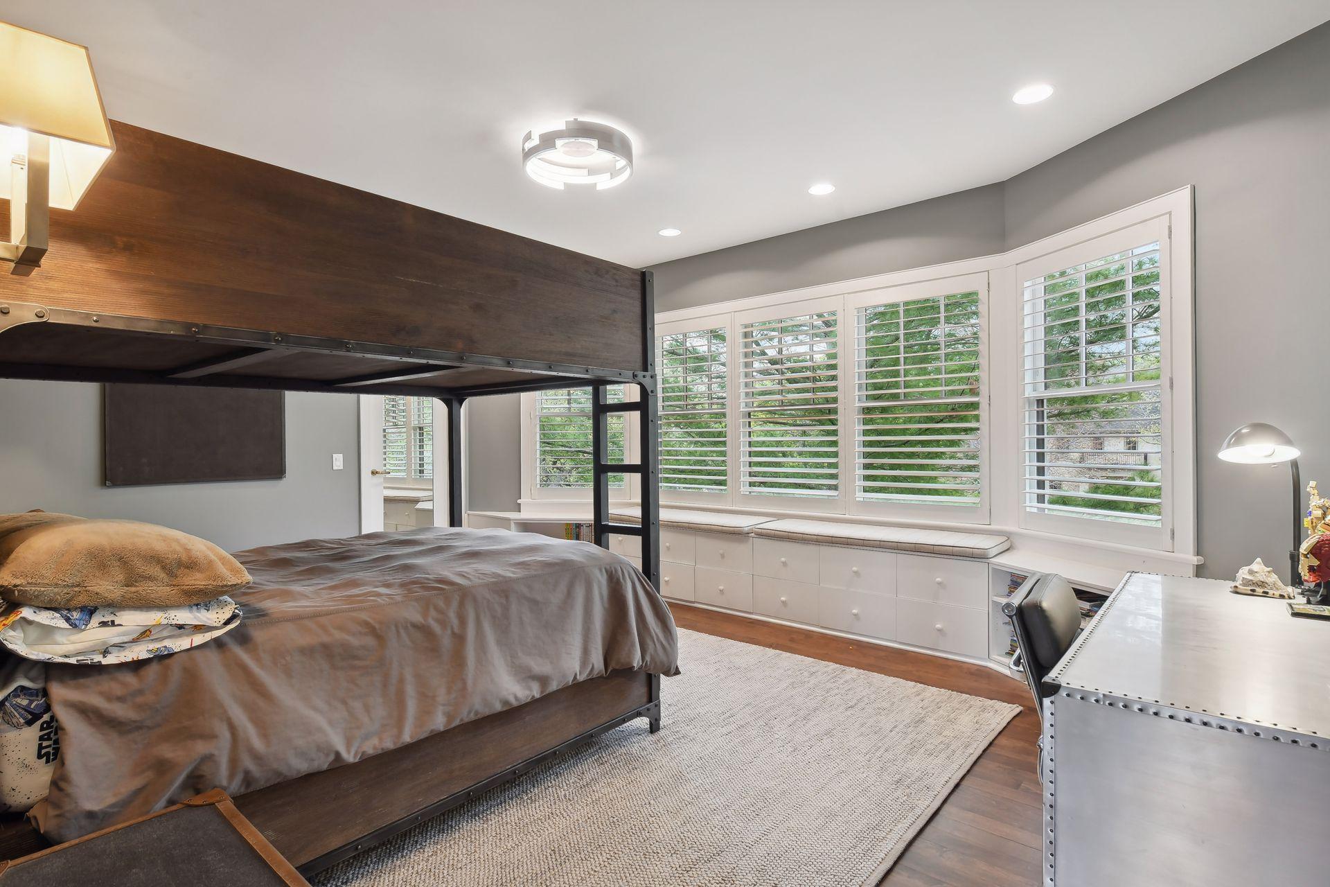 Three additional bedrooms are found on the second floor, this one with built-in window bench seating (BR #2)