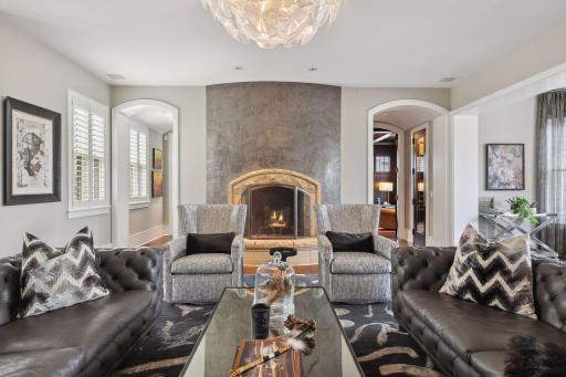 A wood-burning fireplace anchors one end of the formal living room