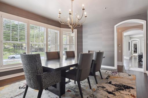 The dining room is just steps away from both the formal living room and kitchen