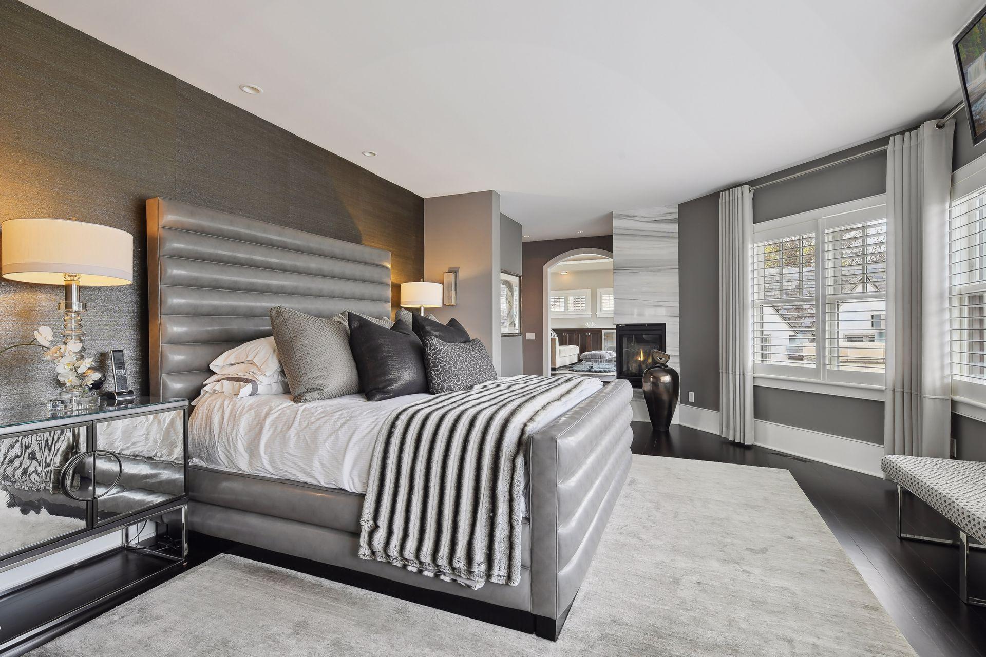 Retreat to the luxurious primary suite at the end of the day