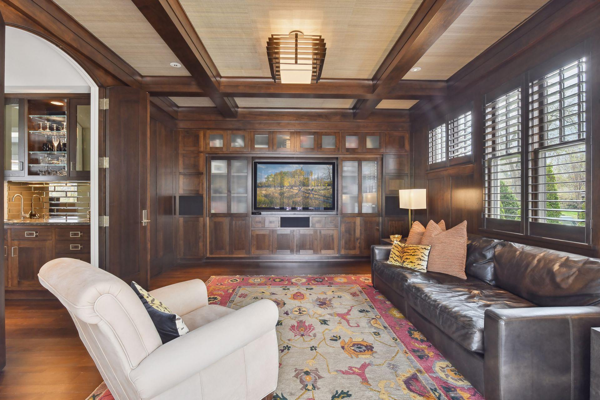 Rich wood beams and built-ins add to the warm atmosphere of this space