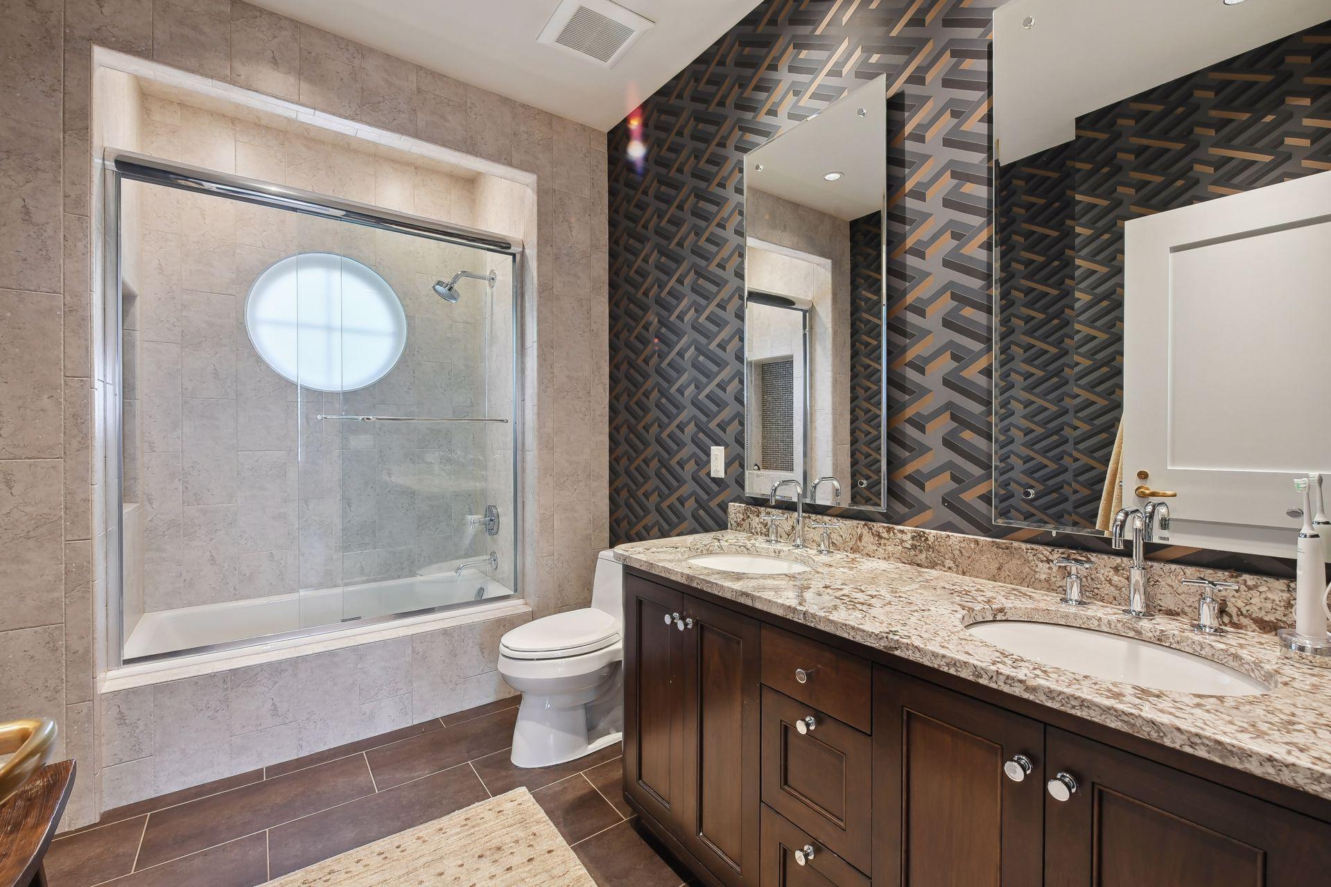 One of two secondary full bathrooms on the second floor