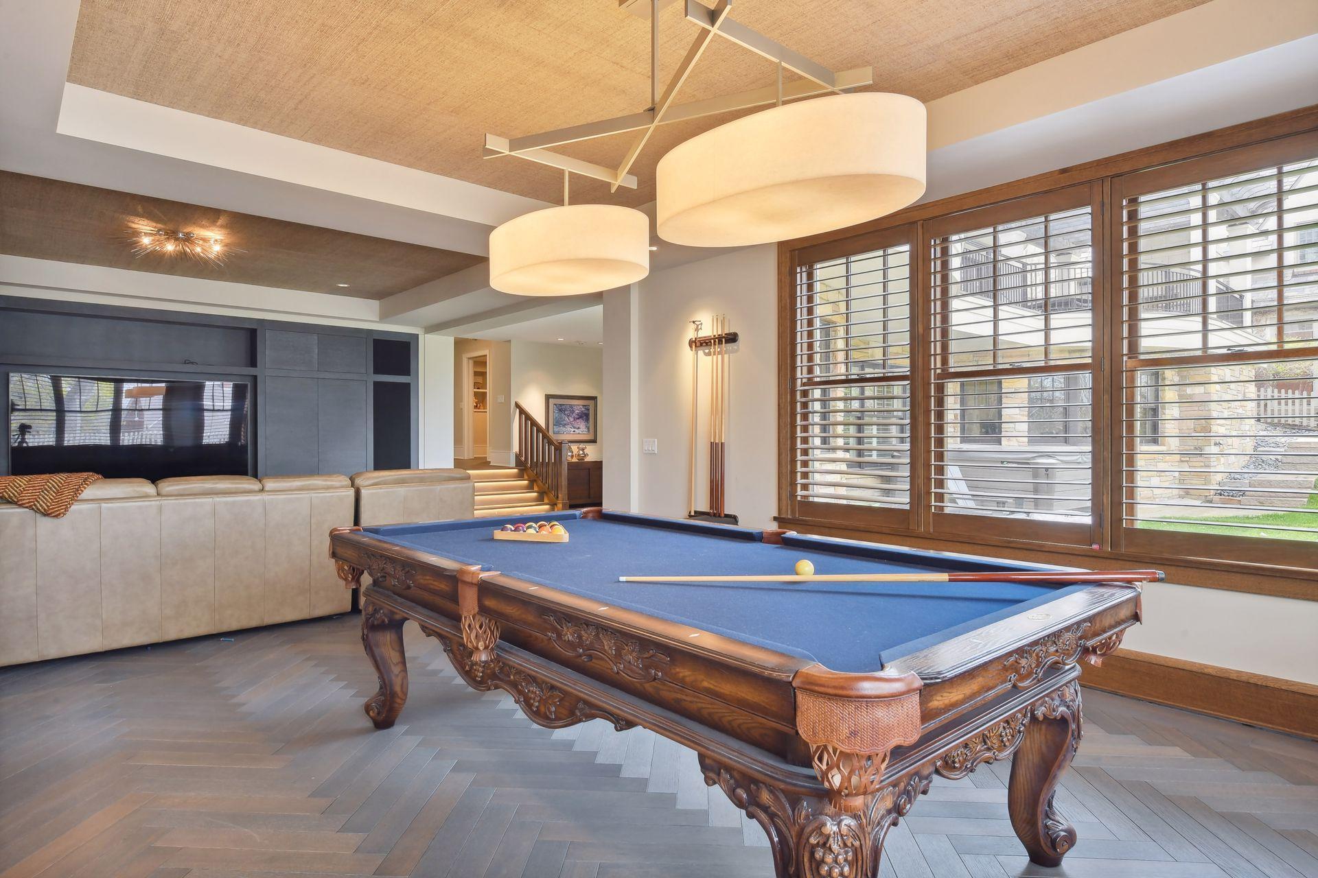 Game area with flooring laid in a design-savvy herringbone pattern