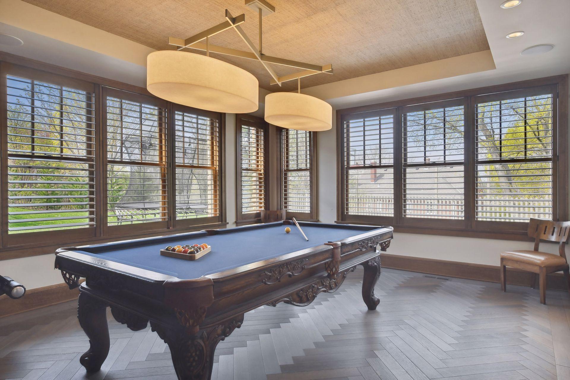 Game area with flooring laid in a design-savvy herringbone pattern