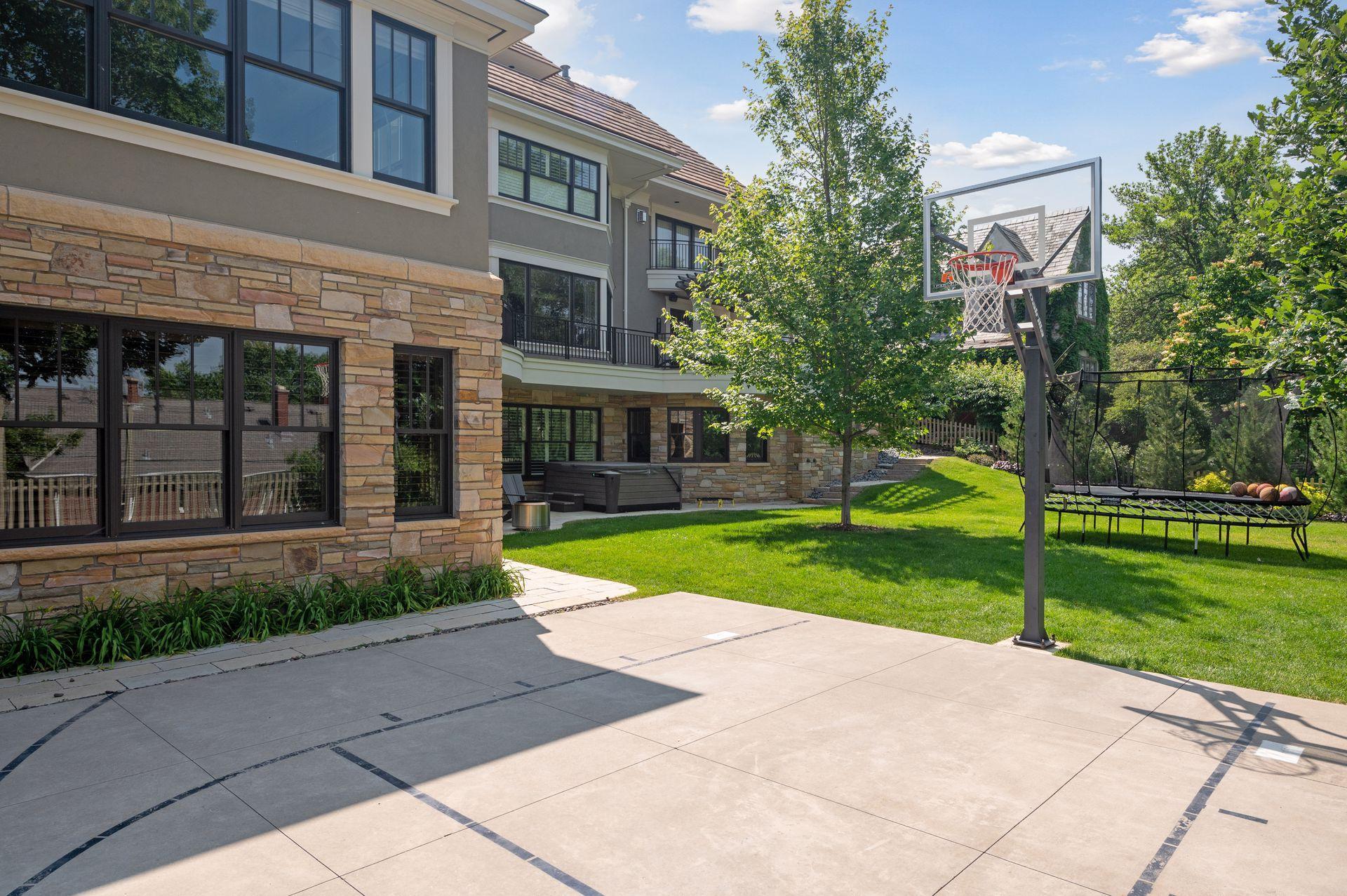 Outdoor sport court with basketball hoop