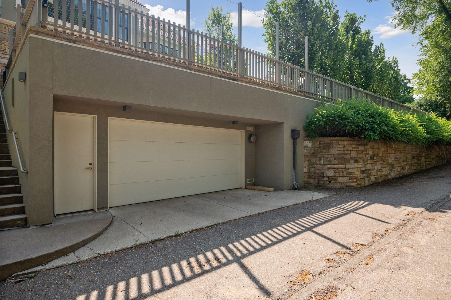 The home offers two garages, both heated. The one up front provides space for three cars, this one in the back of the house provide room for two cars.