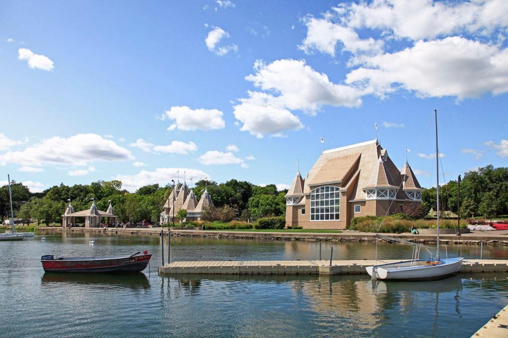 Year-round activity at Lake Harriet includes walking and biking trails, sailing, swimming, skating, summer music and movies at the bandshell