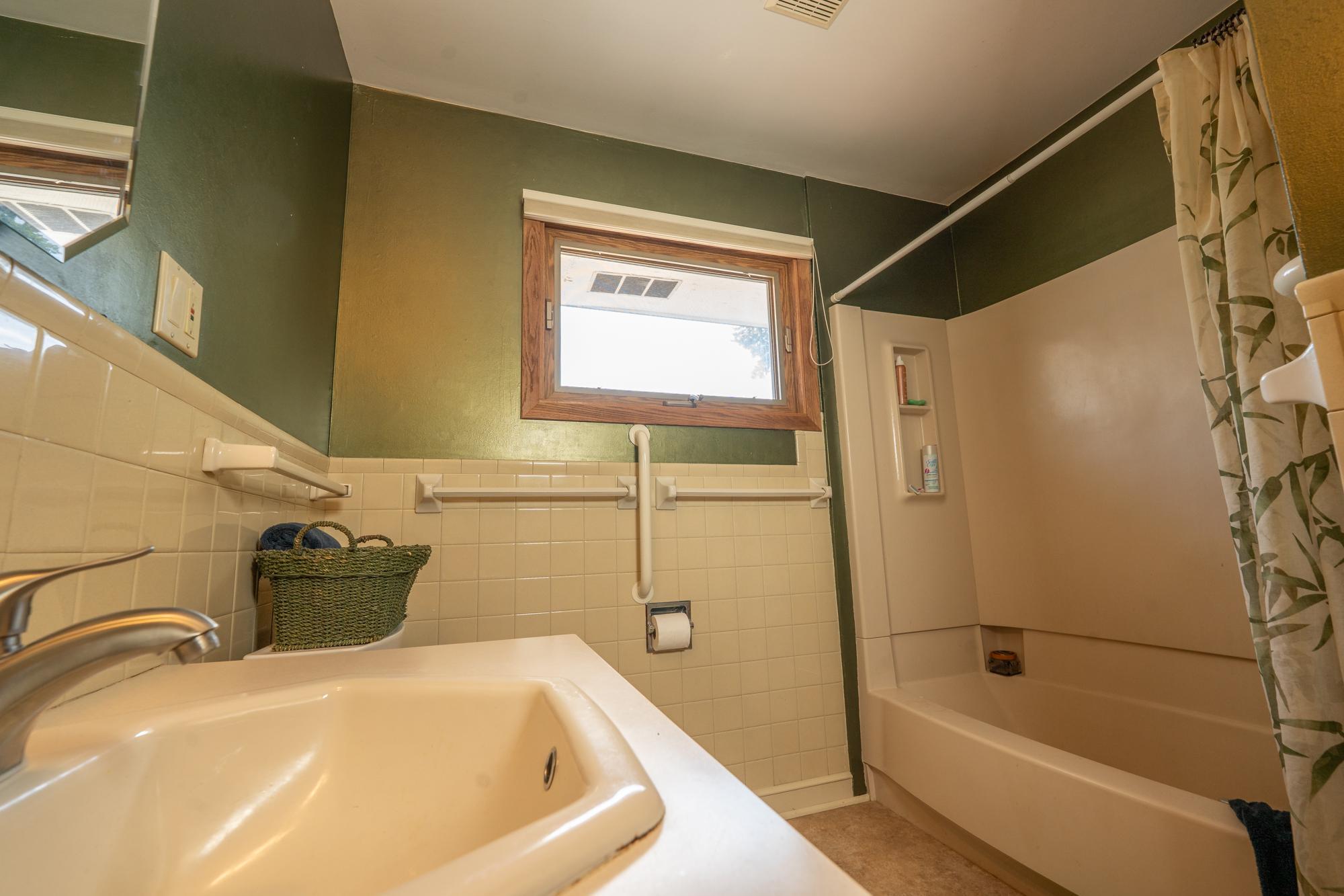There are two bathrooms in the home. This is the full bathroom on the upper level next to all three of the bedrooms.