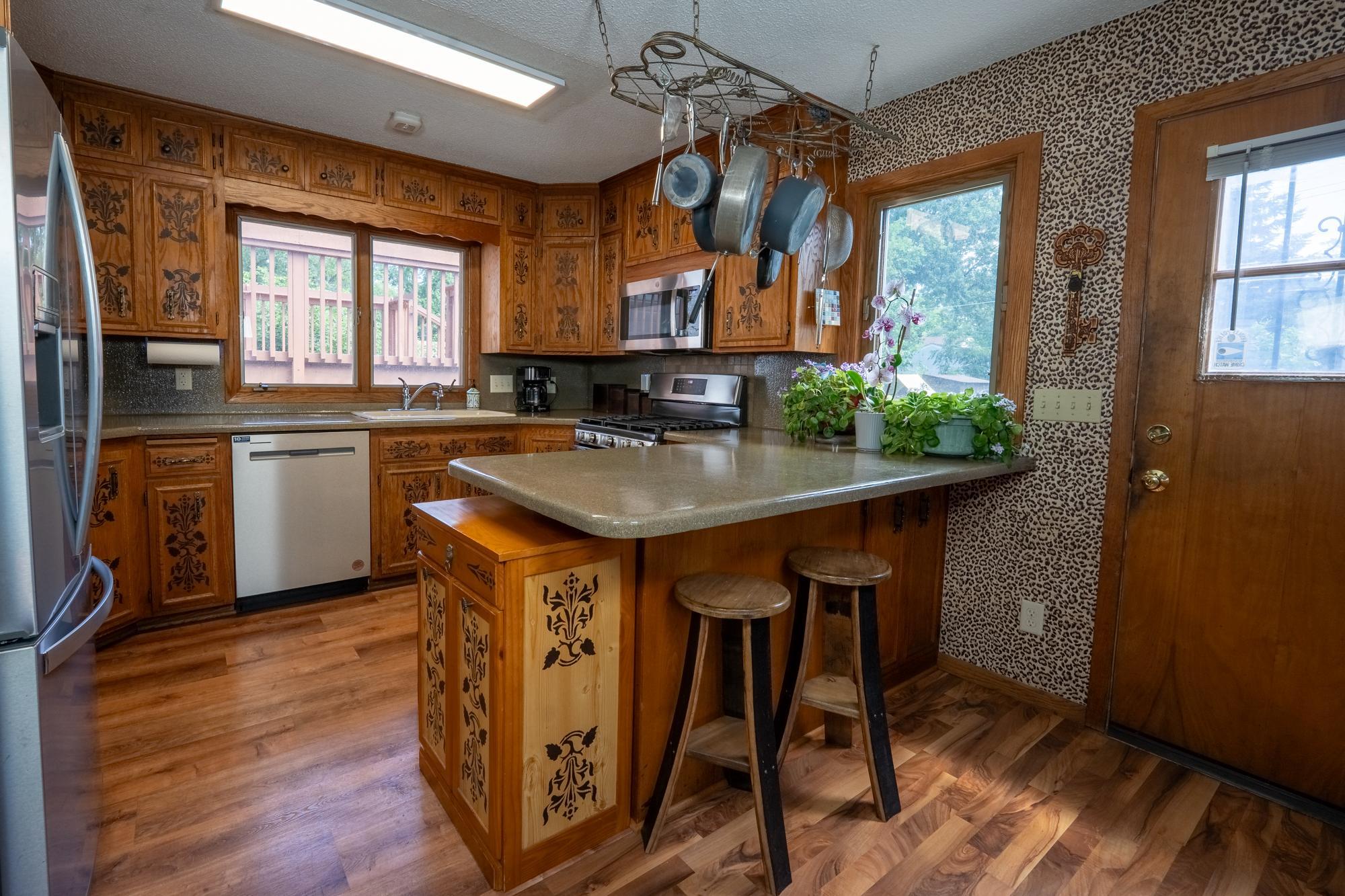 Spacious kitchen with lots of countertop space as well as cabinet space for storage. Do you even have a breakfast bar for quick meals on the go. Beautiful hardwood floors, all appliances stay with the home.
