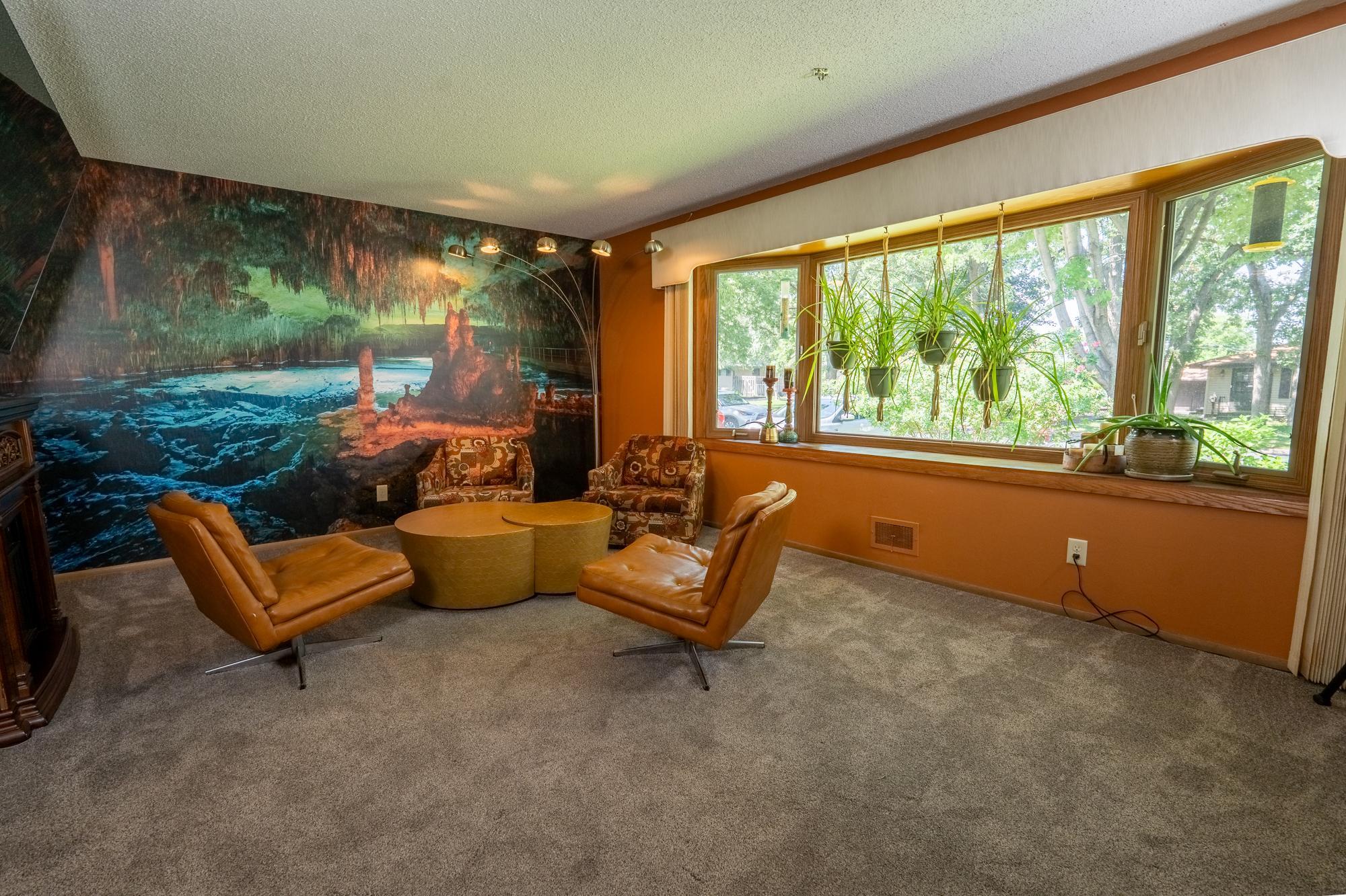 This is the front living room and it's one of three family rooms in the house. There's a lower level family room that was a home theater and the lowest level of the house has another space that could be set up as a game room or amusement room