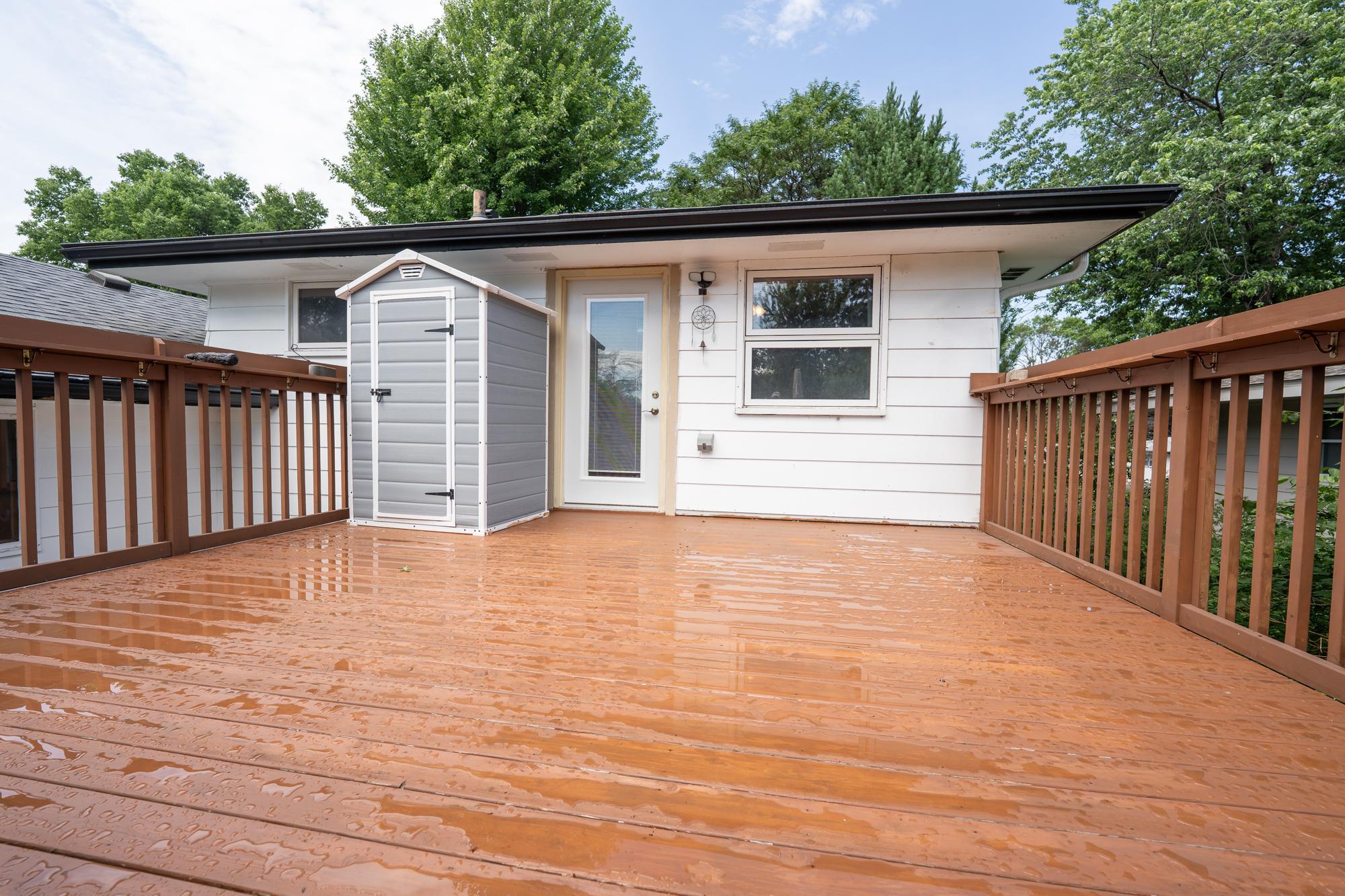 The deck is spacious and located right off of 1 of the bedrooms. It overlooks the backyard, pool and is on top of the three season porch