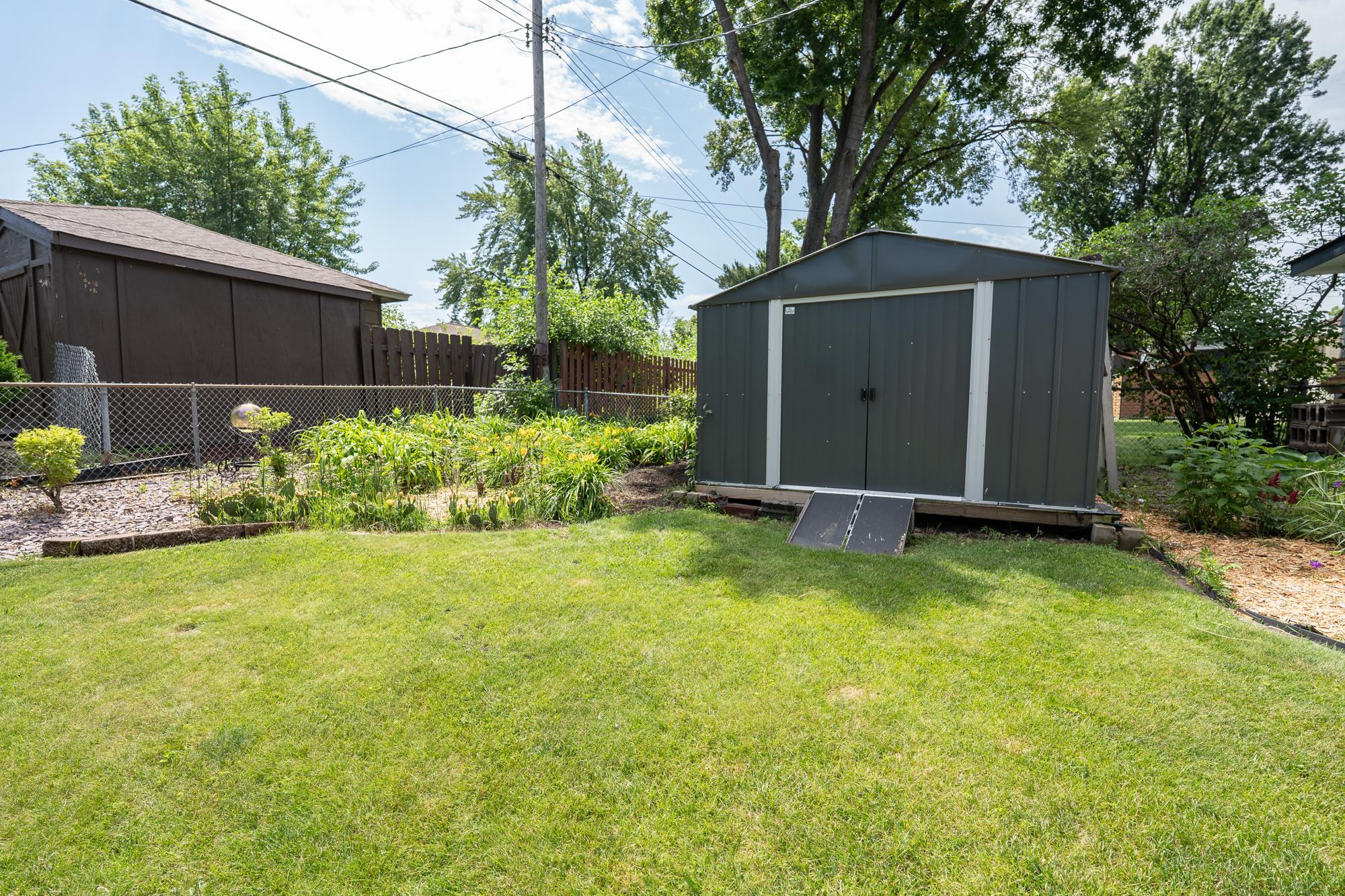 In addition to the spacious 2 car garage there are two storage sheds in the backyard for all of the extra things that you don't want to put in the garage like a lawn mower, gardening tools, hoses and anything else you need to store