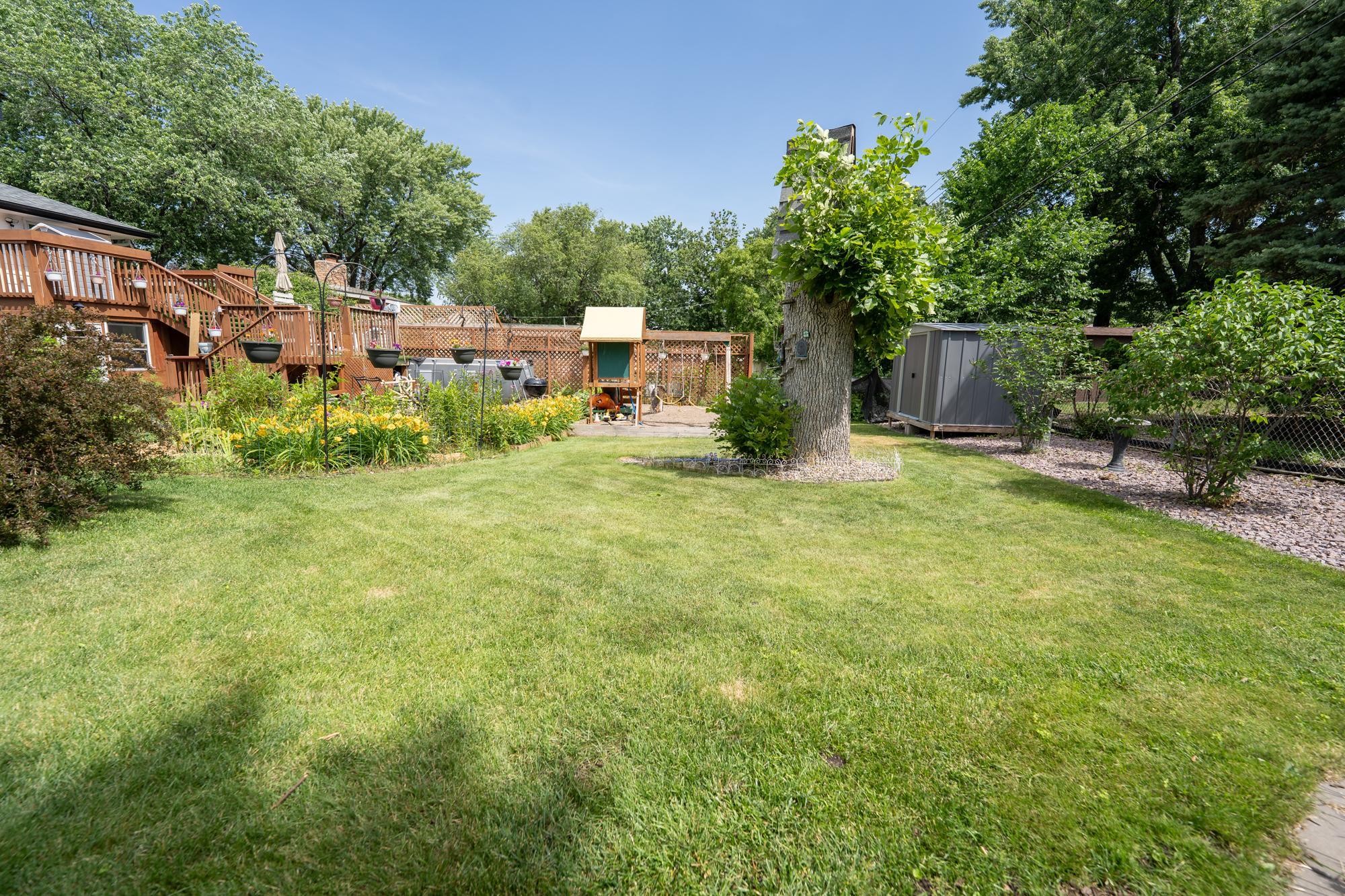 This gives you perspective that you still have a lot of open yard space if you wanted to create additional gardens, a space for any outdoor activity that you enjoy. The yard is fully fenced and ready for a pet