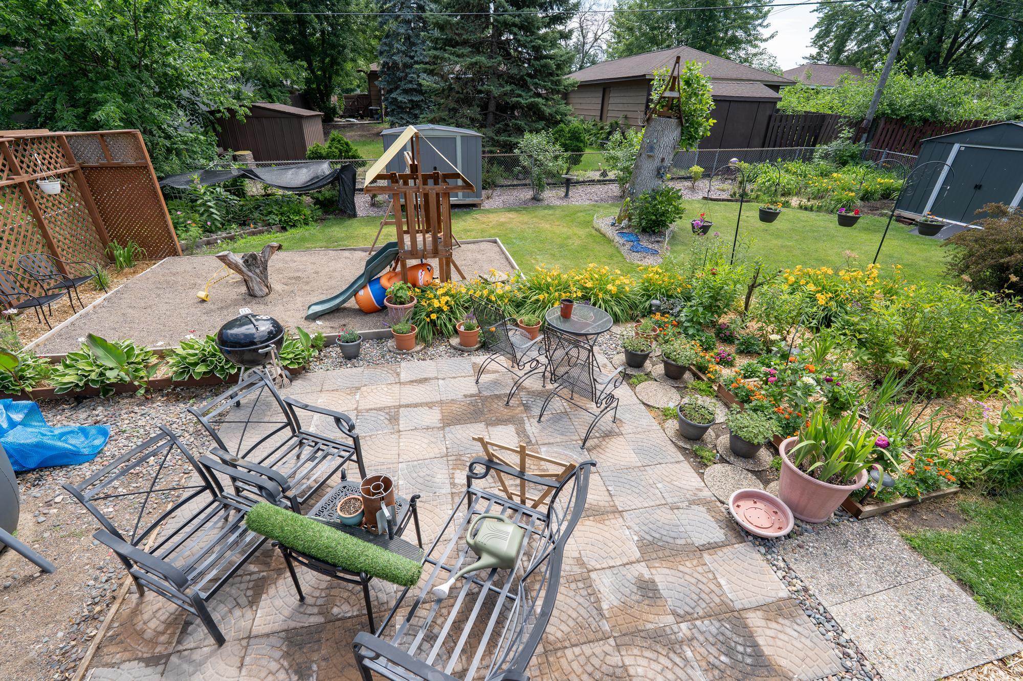 Paver patio in the backyard in the middle of everything is a great place to spend a quiet evening with a glass of wine. The entire yard is fenced so if you have a pet it's already set up for it