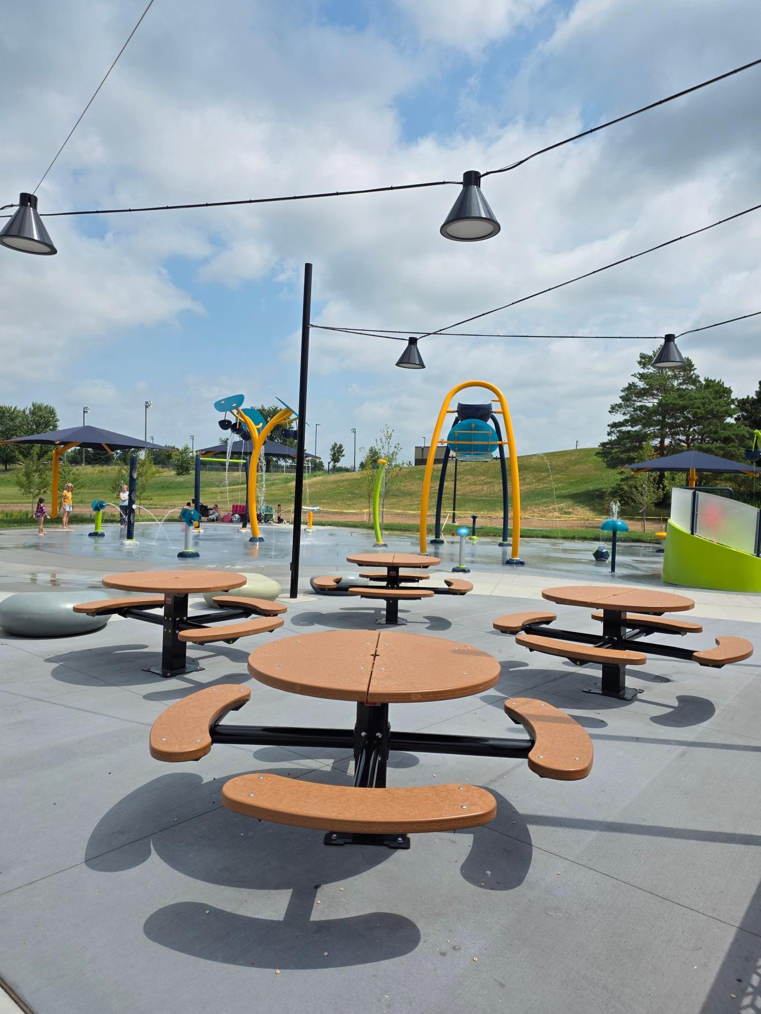 They have several different areas for families to have picnics. Off in the distance is a splash park which is part of Commons, again this is free to everyone. You can bike or walk here from the house