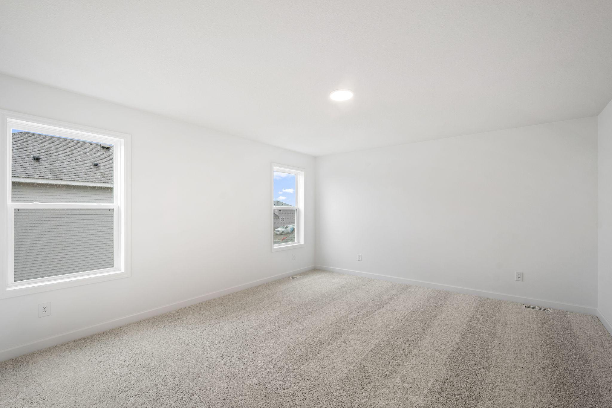 The owner’s suite is located on the home’s second level, complemented by a spa-like bathroom and walk-in closet.