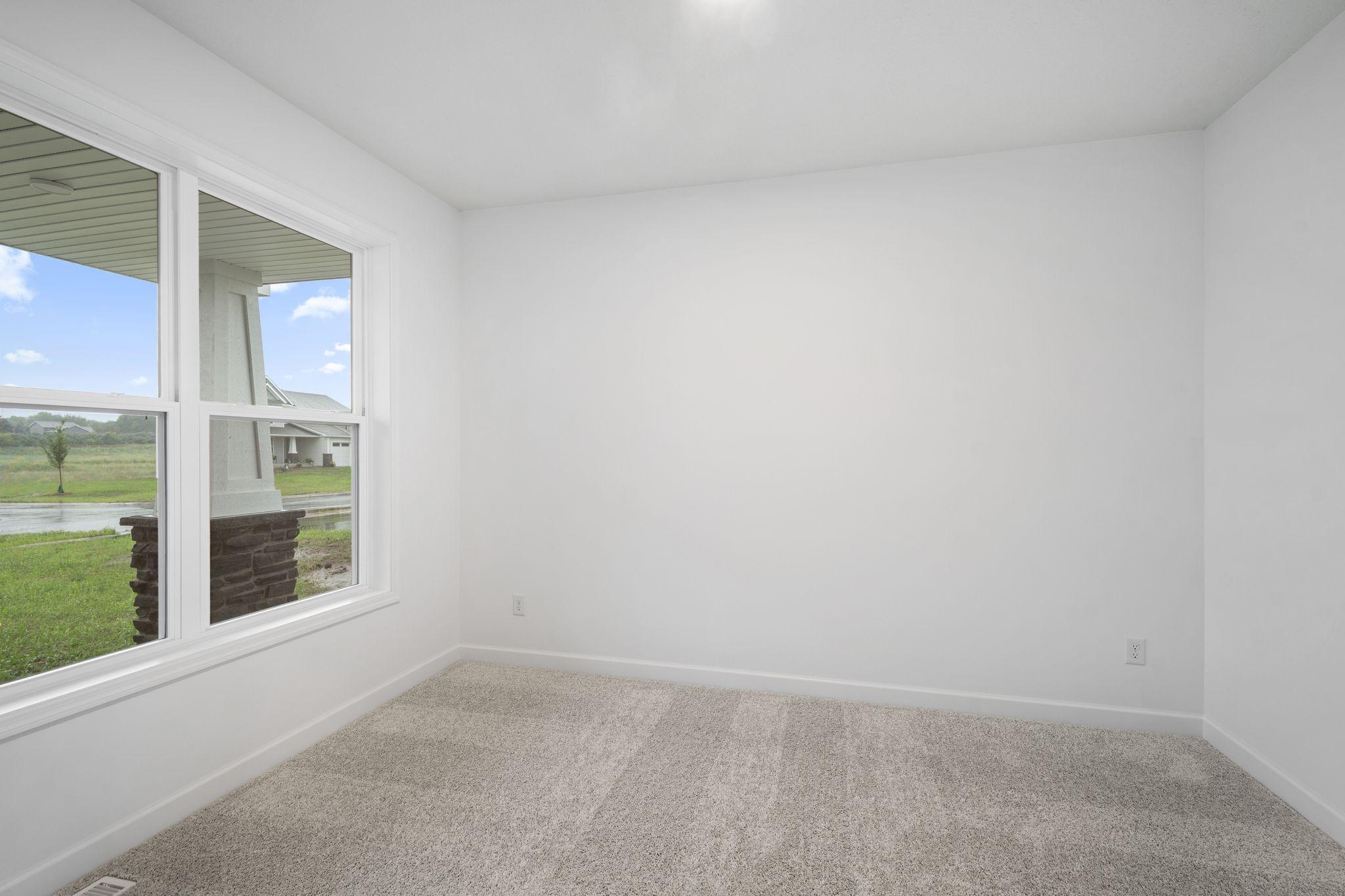 The first-floor flex space can easily operate as a formal dining room, sitting room or home office