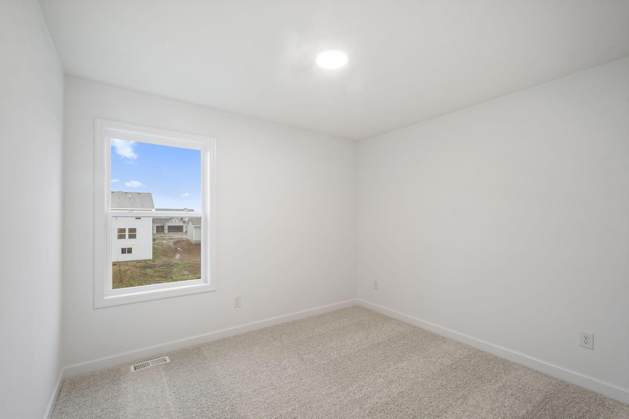 All the secondary bedrooms include a practical wardrobe closet and wall-to-wall carpeting for plush comfort.