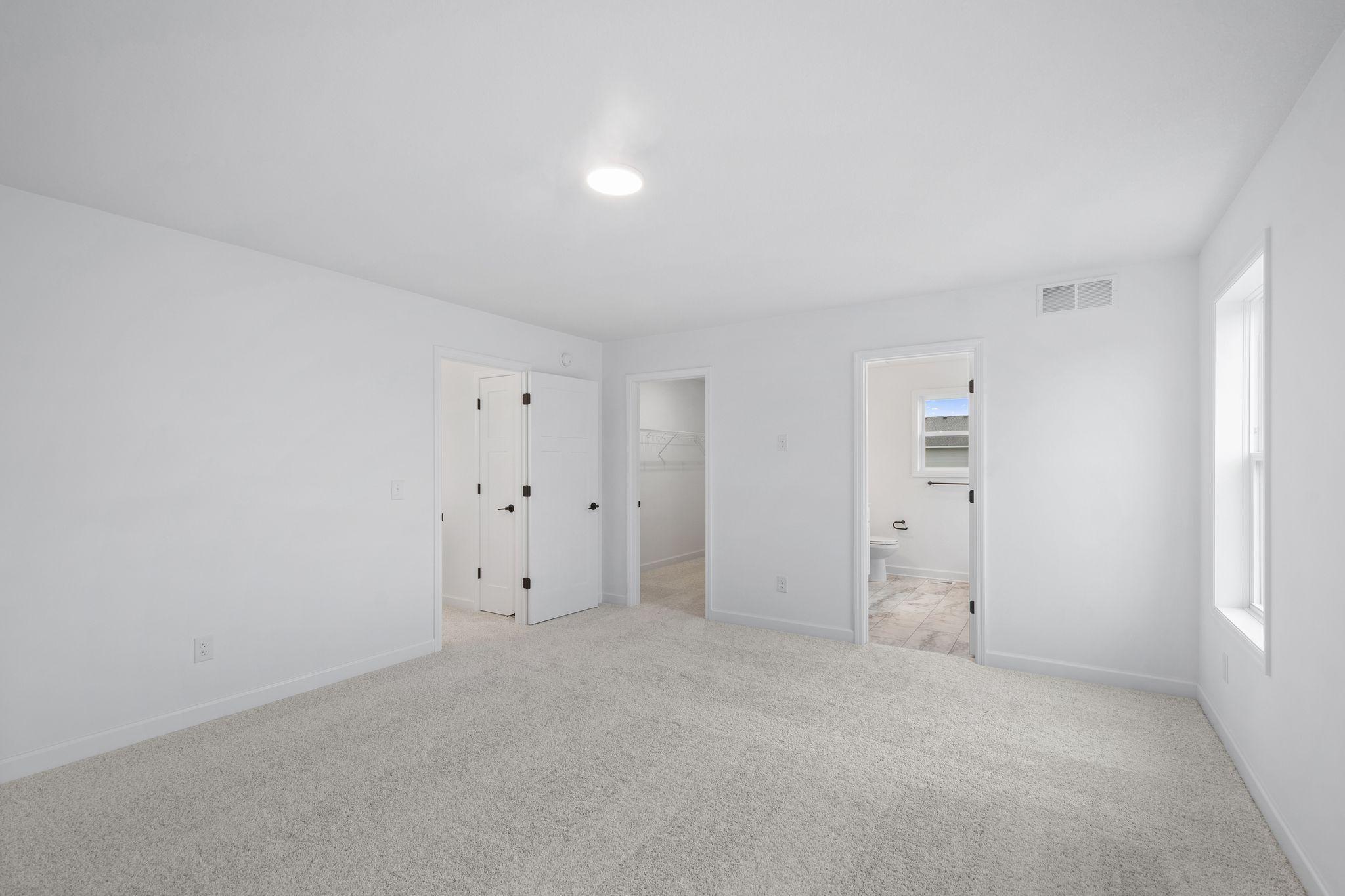 The owner's suite has direct access to a private bath and walk-in closet