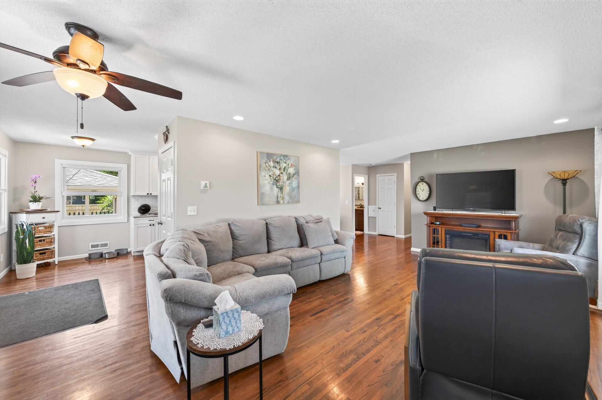 Living room with natural hardwood floors that flow throughout the main floor