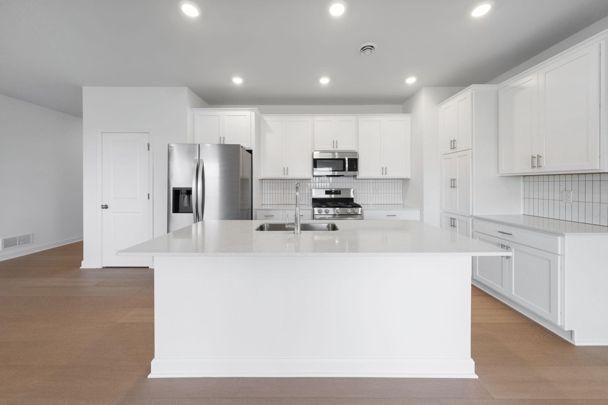 (Photo of a very similar home, actual finishes may vary)