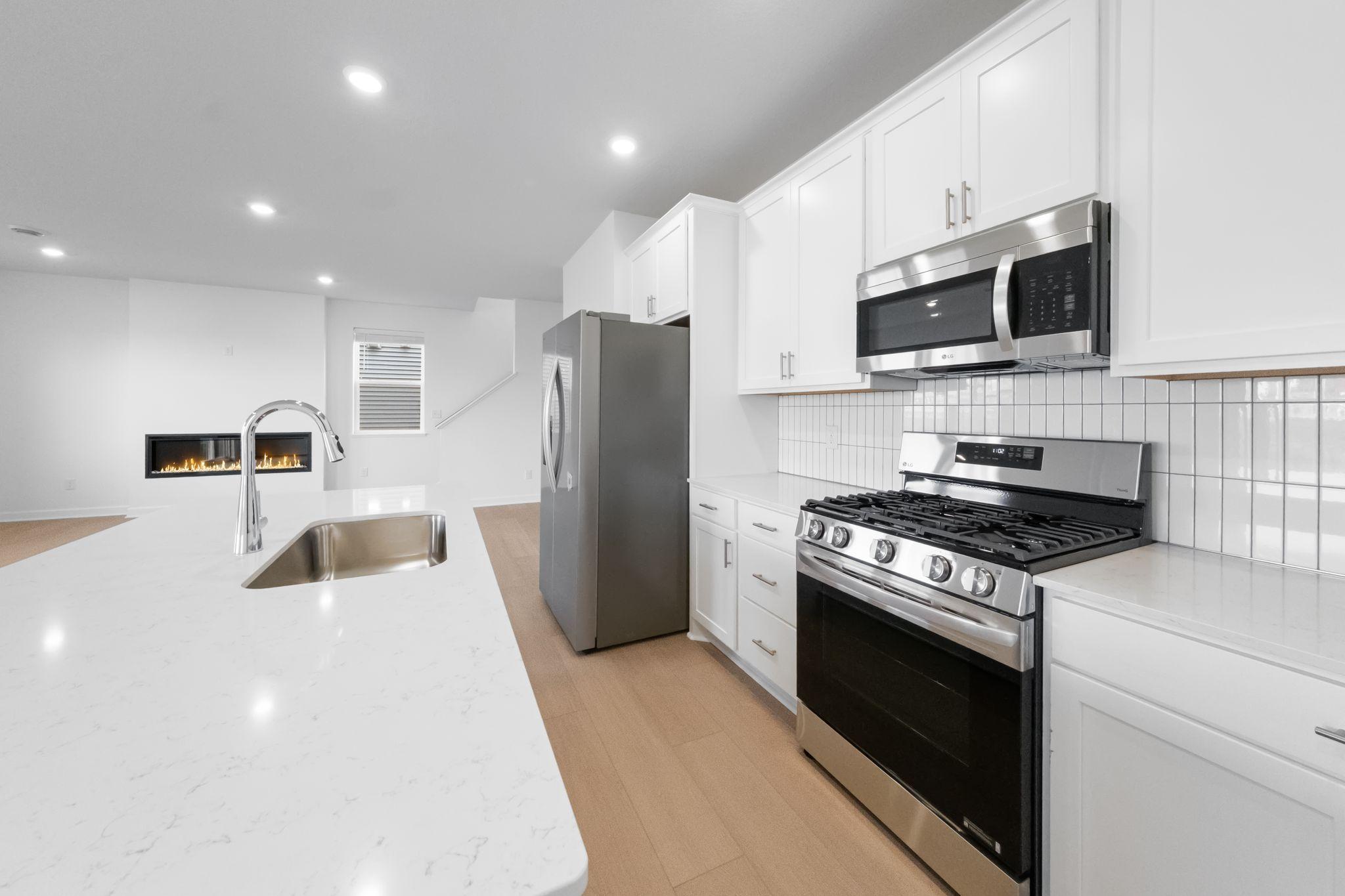 (Photo of a very similar home, actual finishes may vary)